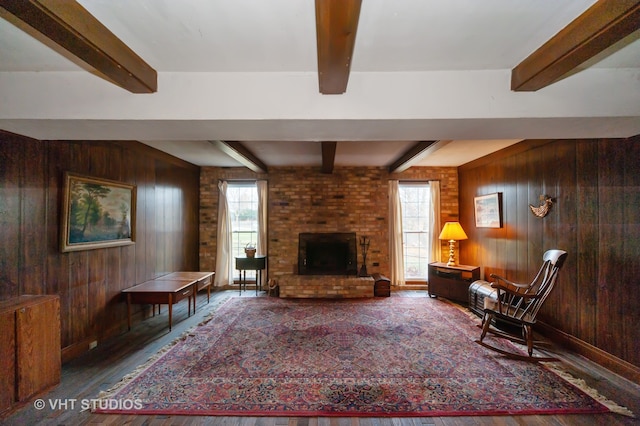 living room with hardwood / wood-style floors and wooden walls