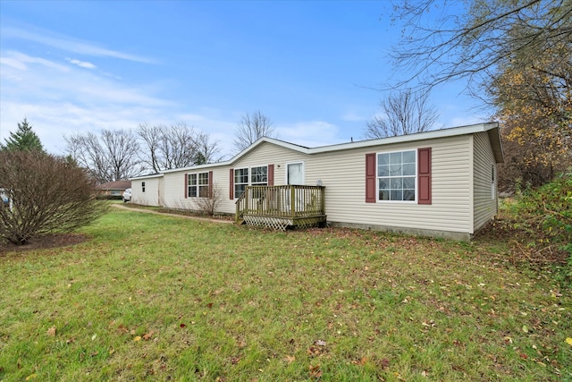 view of front of home with a front lawn and a deck