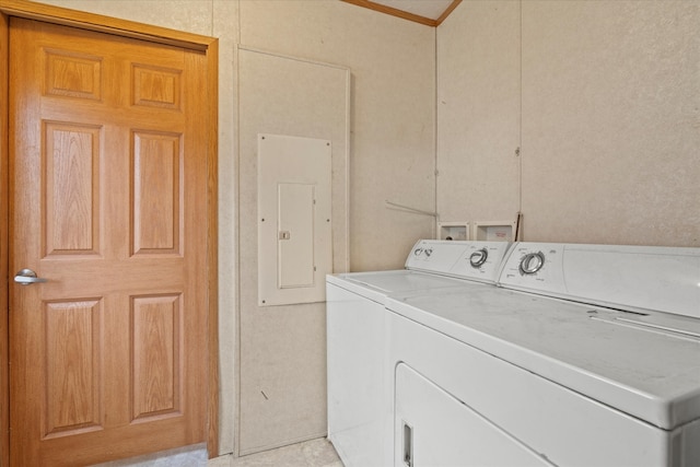 laundry room with washing machine and dryer and electric panel