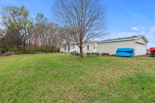 view of yard with a garage