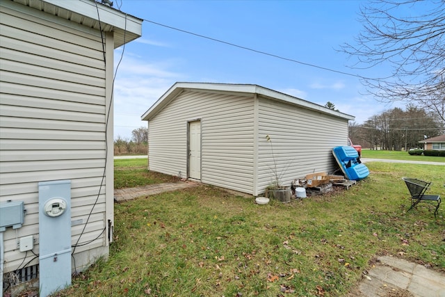 view of outbuilding featuring a lawn