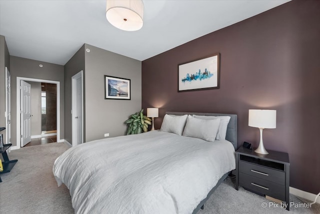 carpeted bedroom with ensuite bath