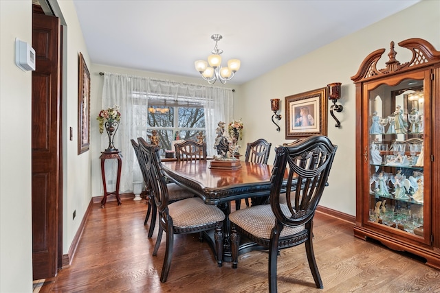 dining space featuring a chandelier and hardwood / wood-style floors