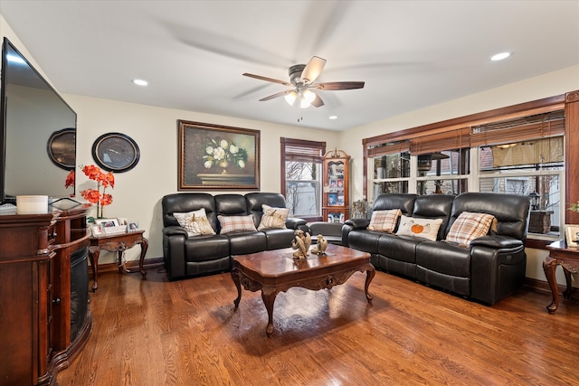 living room with hardwood / wood-style floors and ceiling fan