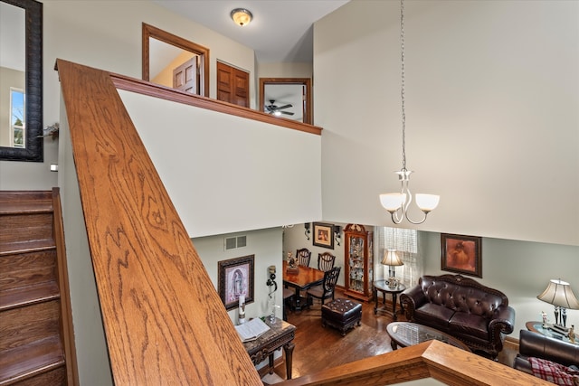 living room with hardwood / wood-style flooring and an inviting chandelier