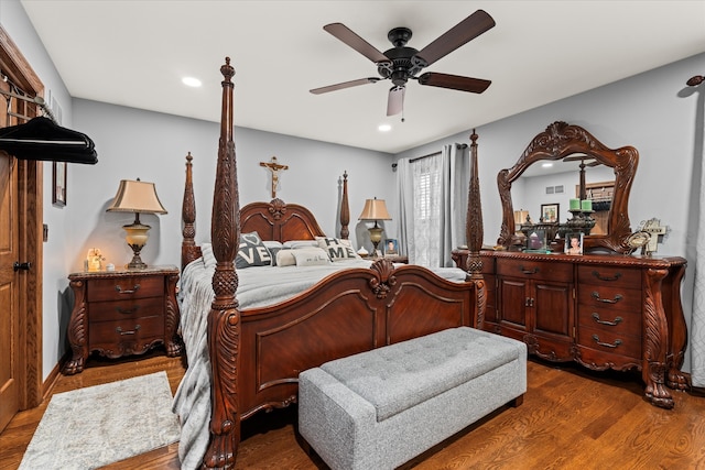 bedroom featuring ceiling fan and dark hardwood / wood-style flooring