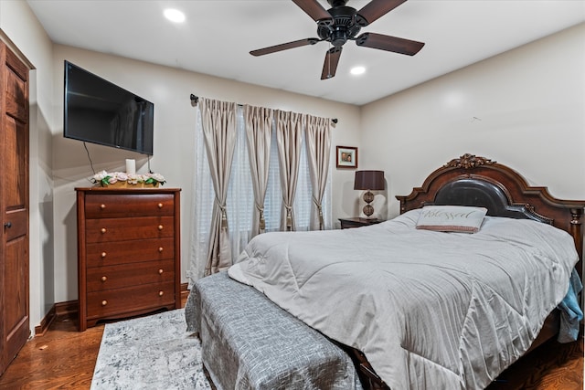 bedroom with hardwood / wood-style floors and ceiling fan