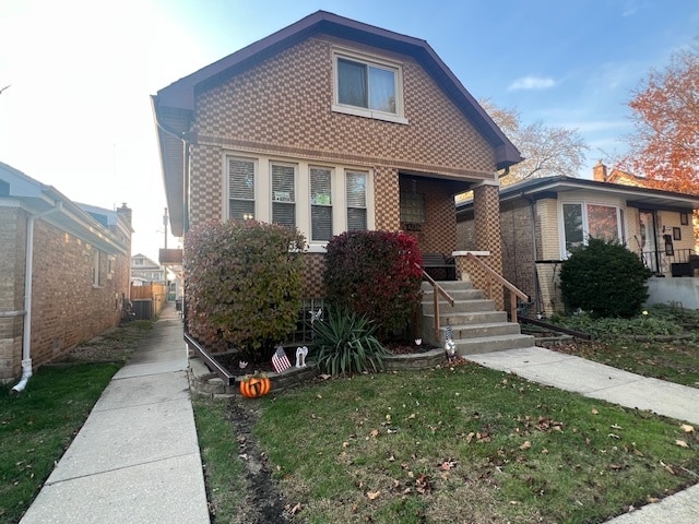 bungalow featuring a porch and a front yard