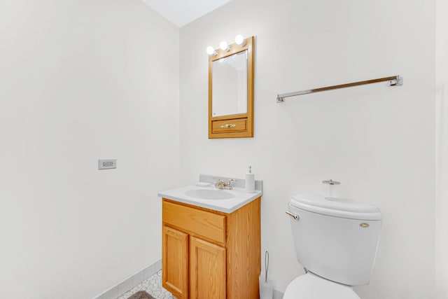 bathroom with vanity, tile patterned floors, and toilet