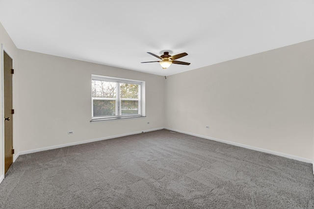 empty room featuring carpet flooring and ceiling fan