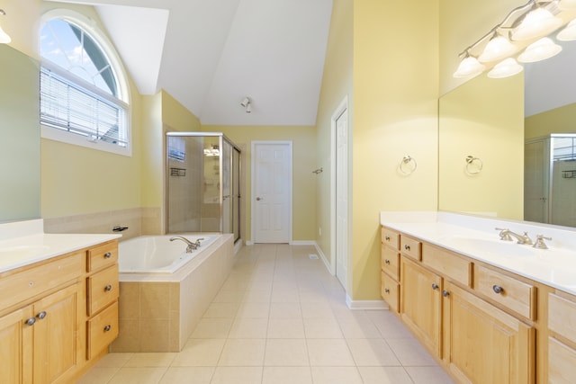 bathroom featuring tile patterned flooring, vanity, independent shower and bath, and lofted ceiling