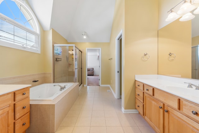 bathroom with vanity, tile patterned flooring, plus walk in shower, and lofted ceiling