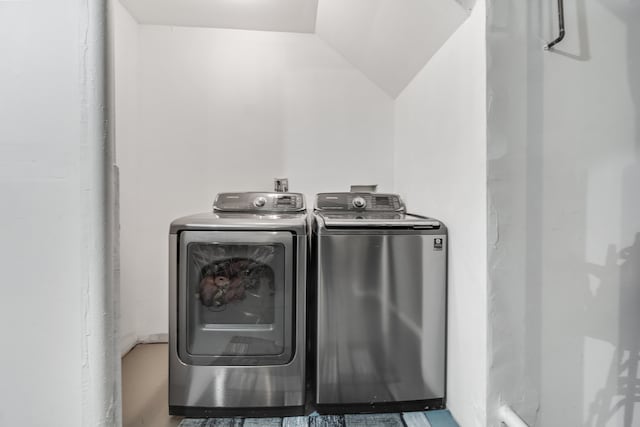 washroom with laundry area and washer and dryer