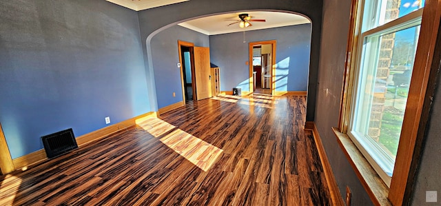 empty room featuring crown molding, ceiling fan, and hardwood / wood-style flooring