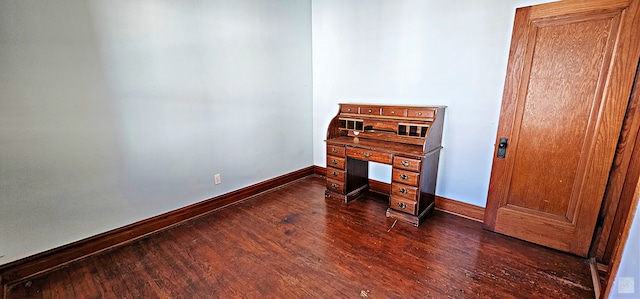 office with dark hardwood / wood-style flooring