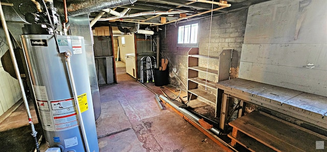 basement featuring washer / clothes dryer and water heater