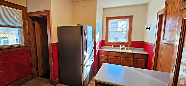 kitchen with stainless steel refrigerator and sink