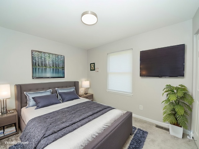 bedroom with light carpet