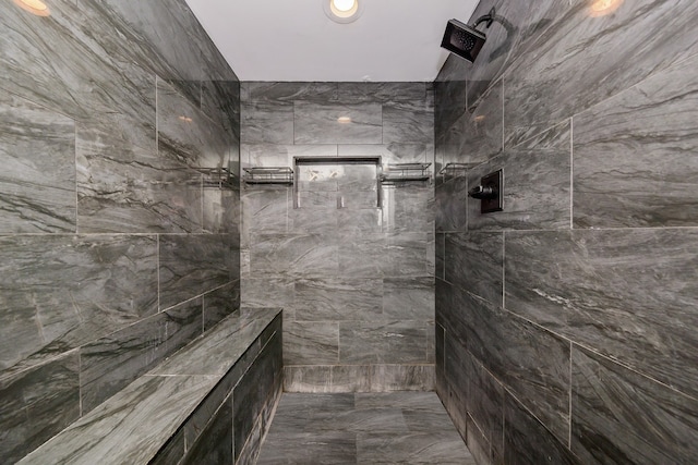 bathroom featuring a tile shower