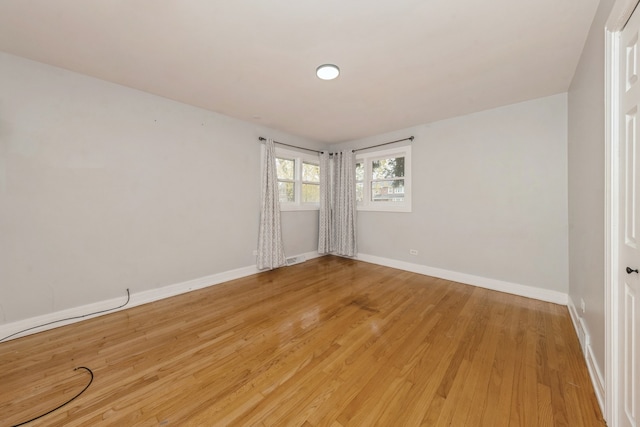 spare room featuring light wood-type flooring