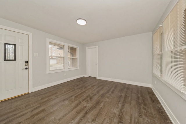 foyer entrance with dark hardwood / wood-style floors