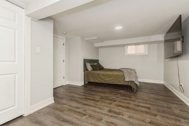 bedroom featuring dark hardwood / wood-style flooring