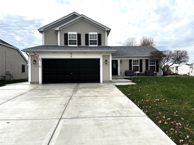 front of property with a garage and a front yard