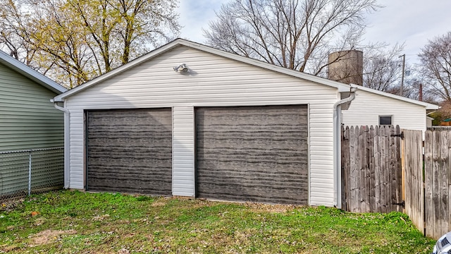 garage with a lawn