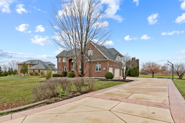 front facade featuring a garage and a front lawn