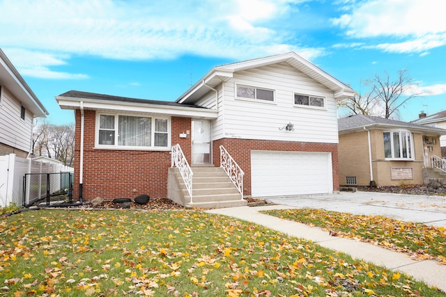 split level home featuring a front yard and a garage