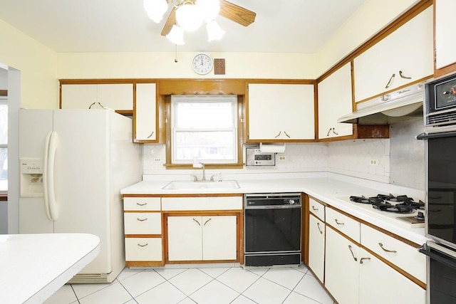 kitchen featuring black appliances, sink, decorative backsplash, ceiling fan, and white cabinetry