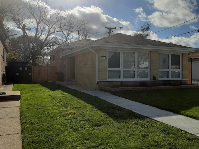 view of home's exterior with a lawn