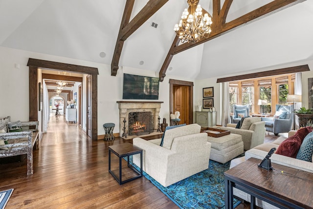 living room with high vaulted ceiling, a premium fireplace, beam ceiling, wood-type flooring, and a chandelier