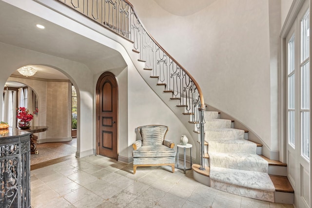 stairway with a towering ceiling