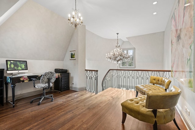 office space featuring hardwood / wood-style floors, a chandelier, and vaulted ceiling