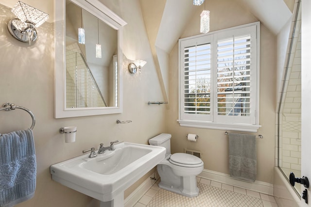 full bathroom with tile patterned floors, sink, bathing tub / shower combination, and vaulted ceiling