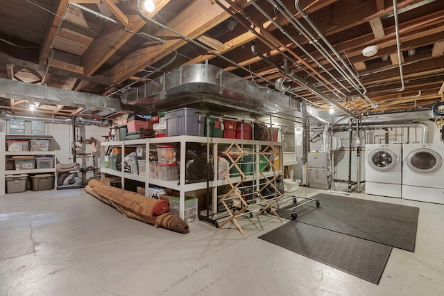 basement featuring washing machine and clothes dryer