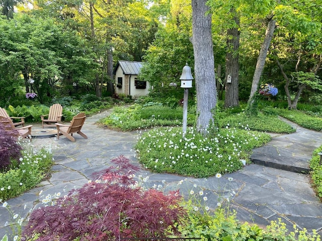 exterior space featuring a patio area and an outdoor structure