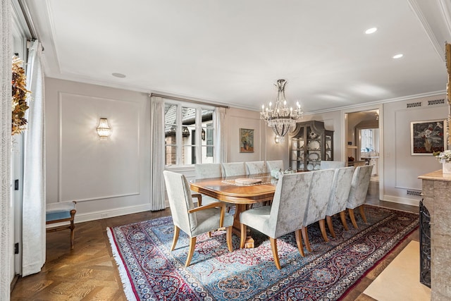 dining room featuring dark parquet floors, a chandelier, and ornamental molding