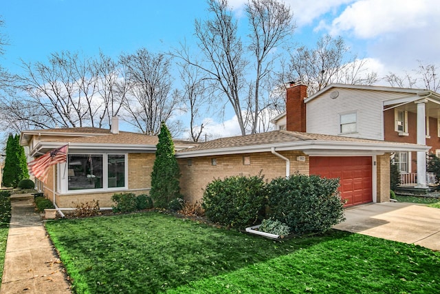 view of front facade with a front yard and a garage