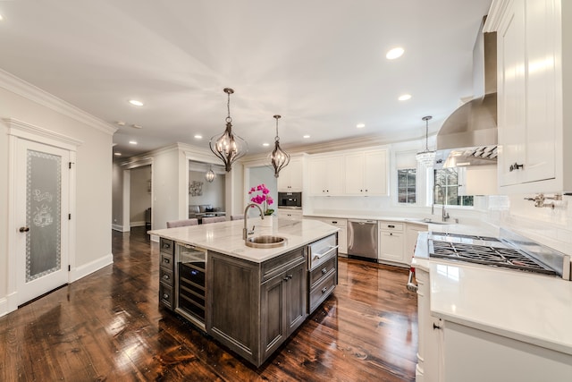 kitchen featuring dark hardwood / wood-style flooring, stainless steel appliances, exhaust hood, sink, and a center island