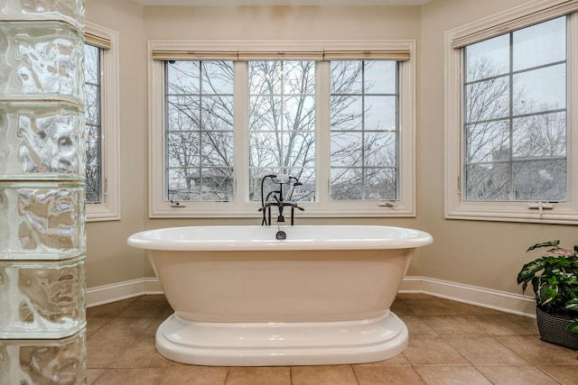 bathroom featuring tile patterned floors and a bathtub