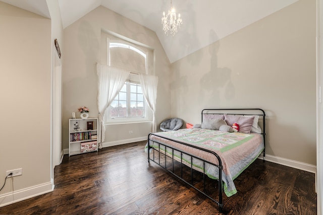 bedroom with dark hardwood / wood-style flooring, an inviting chandelier, and vaulted ceiling