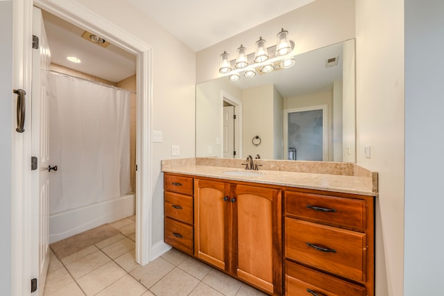 bathroom featuring tile patterned flooring, shower / tub combo, and vanity