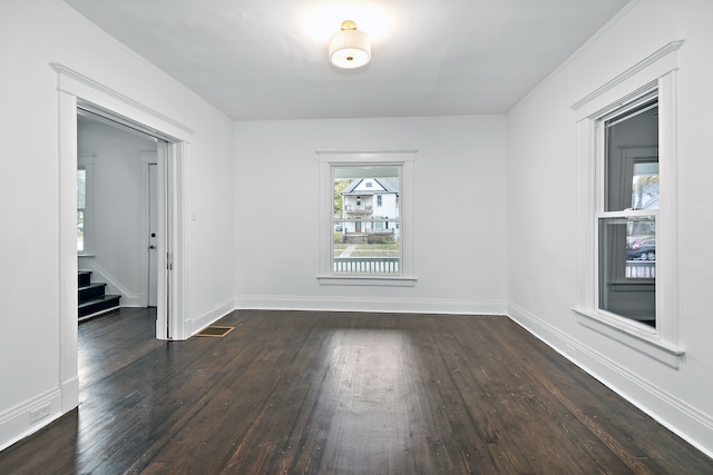 unfurnished room with dark hardwood / wood-style floors