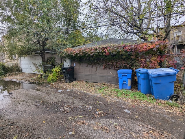 view of side of property with a garage