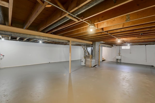 basement with sink and heating unit