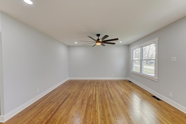 spare room with light hardwood / wood-style flooring and ceiling fan