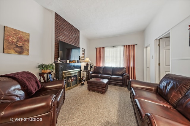 carpeted living room with a textured ceiling and a large fireplace