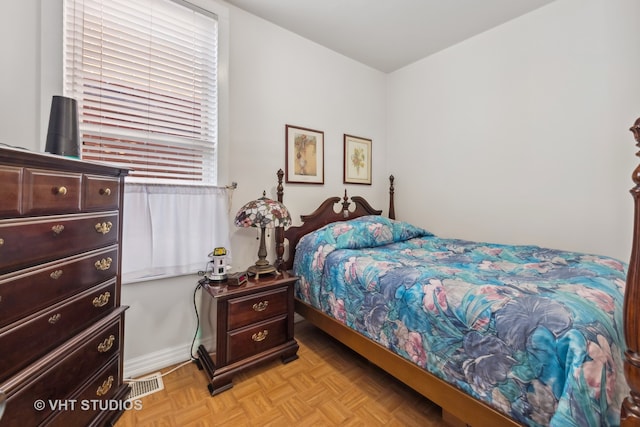 bedroom featuring light parquet floors